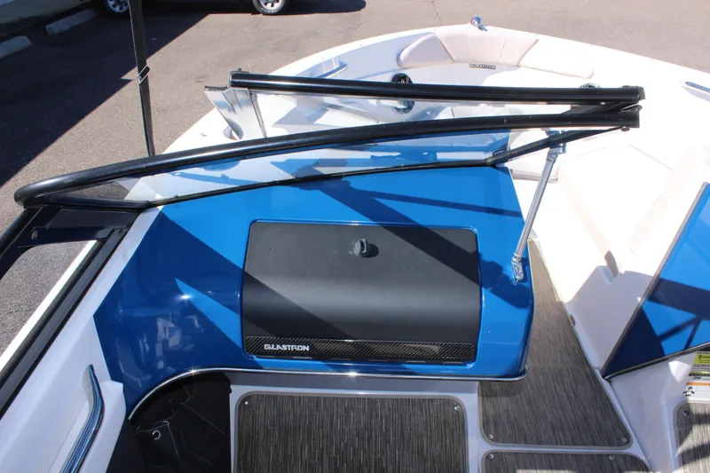 Slide: The Image of 2018 Glastron GT200 boat interior with blue and black dashboard. - 18