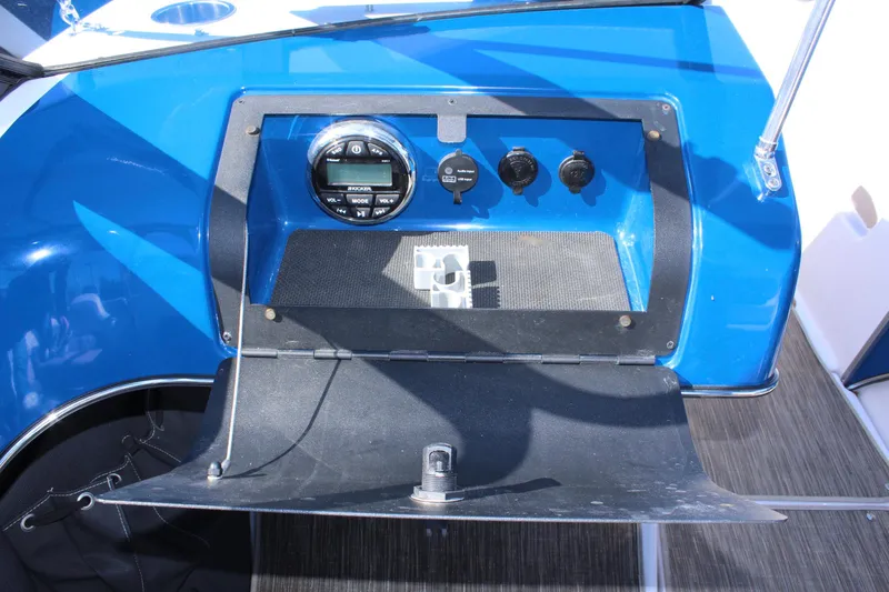 Slide: The Image of 2018 Glastron GT200 boat dashboard with gauges and controls. - 19