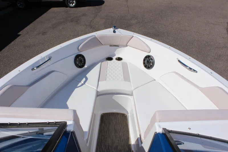 Slide: The Image of 2018 Glastron GT200 boat bow seating area with speakers and cup holders. - 20