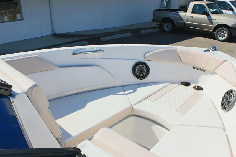 Slide: The Image of 2018 Glastron GT200 boat interior with white and beige seating. - 21