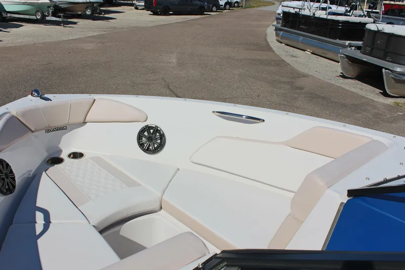 Slide: The Image of 2018 Glastron GT200 boat interior with white and beige seating. - 22