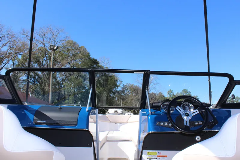 Slide: The Image of 2018 Glastron GT200 boat interior with steering wheel and dashboard. - 24