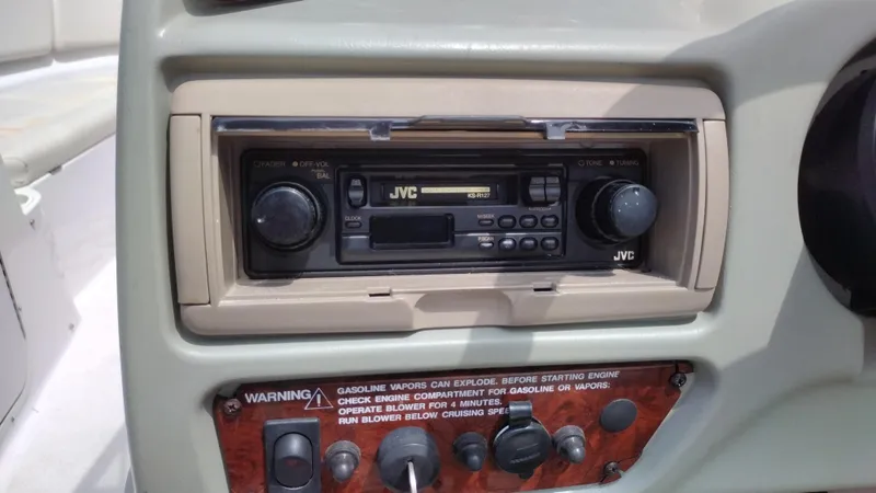 Slide: The Image of 1996 Chaparral 2330 SS boat dashboard with JVC stereo system. - 12
