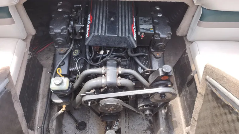 Slide: The Image of 1996 Chaparral 2330 SS boat engine compartment with visible engine components. - 13