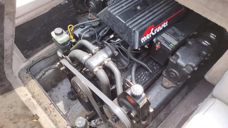Slide: The Image of 1996 Chaparral 2330 SS boat engine compartment with MerCruiser engine. - 14