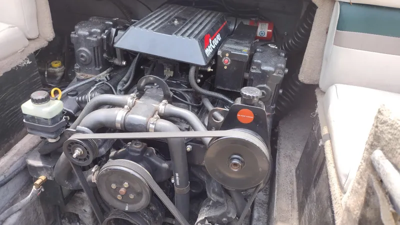 Slide: The Image of 1996 Chaparral 2330 SS boat engine compartment with visible components. - 15