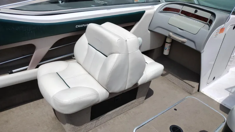 Slide: The Image of 1996 Chaparral 2330 SS boat interior with white leather seats. - 17