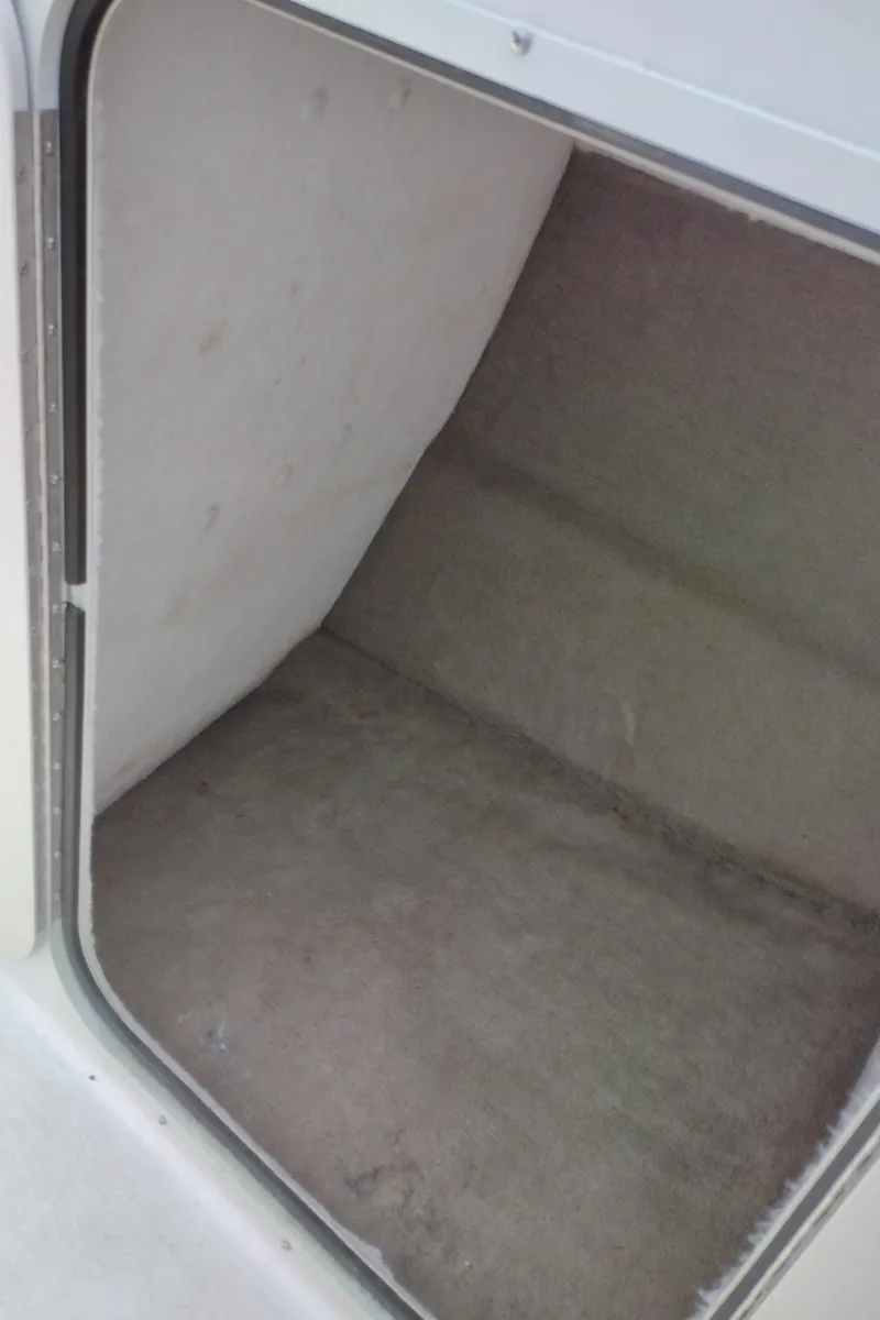 Slide: The Image of Storage compartment of a 1996 Chaparral 2330 SS boat. - 22