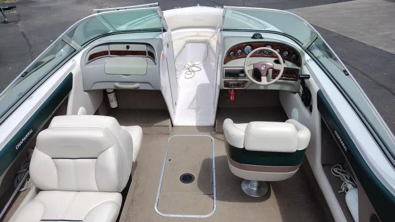 Slide: The Image of 1996 Chaparral 2330 SS boat interior with white and green seating. - 6