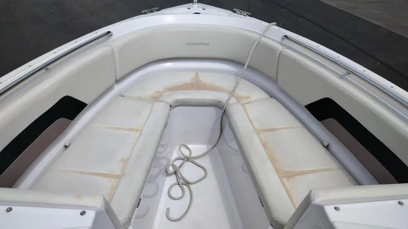 Slide: The Image of 1996 Chaparral 2330 SS boat bow seating area with white upholstery and rope. - 8