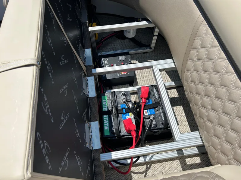 Slide: The Image of 2024 Crest Classic Platinum 240 SLC battery compartment with wiring and seating. - 11