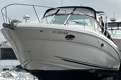 Slide: The Image of 2007 Sea Ray 290 Amberjack boat docked, front view. - 1