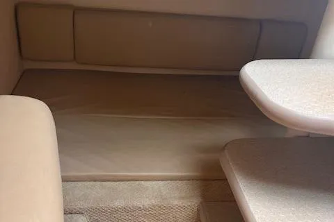 Slide: The Image of Interior cabin of 2007 Sea Ray 290 Amberjack with beige upholstery. - 5