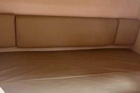 Slide: The Image of Interior seating of 2007 Sea Ray 290 Amberjack boat with beige upholstery. - 6