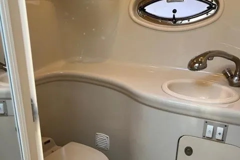 Slide: The Image of 2007 Sea Ray 290 Amberjack boat bathroom with sink and toilet. - 9