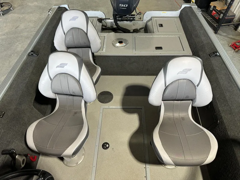 Slide: The Image of 2022 Starcraft Renegade 168 DC boat interior with dual seats and storage compartments. - 1