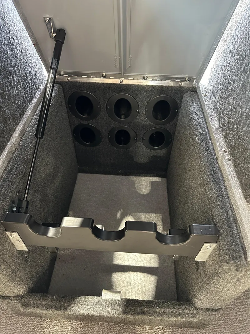 Slide: The Image of 2022 Starcraft Renegade 168 DC rod storage compartment. - 10