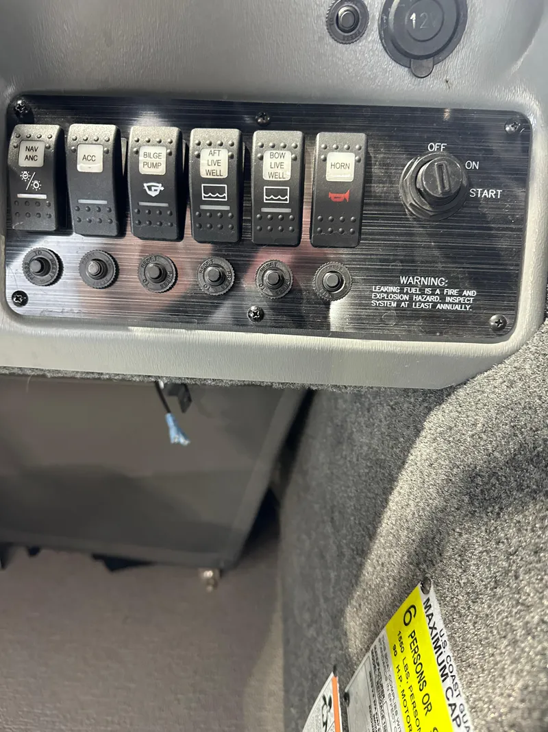 Slide: The Image of Control panel of a 2022 Starcraft Renegade 168 DC boat. - 5