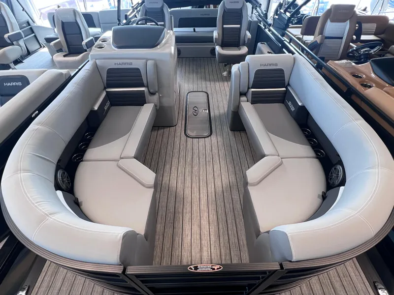 Slide: The Image of 2024 Harris Solstice 230 boat interior with luxurious seating and modern design. - 11