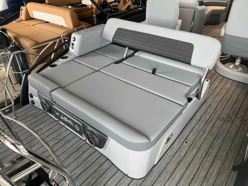 Slide: The Image of 2024 Harris Solstice 230 boat interior with gray cushioned seating and modern design. - 21