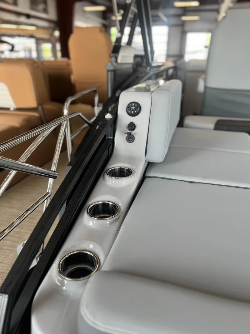 Slide: The Image of 2024 Harris Solstice 230 boat interior with cup holders and seating. - 29
