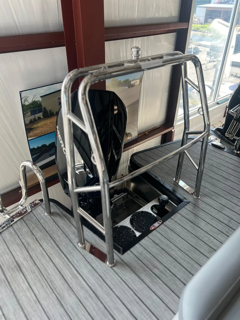 Slide: The Image of 2024 Harris Solstice 230 boat with stainless steel ladder and outboard motor. - 32