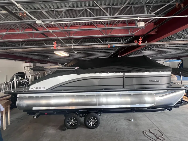 Slide: The Image of 2024 Harris Solstice 230 pontoon boat in indoor storage. - 5
