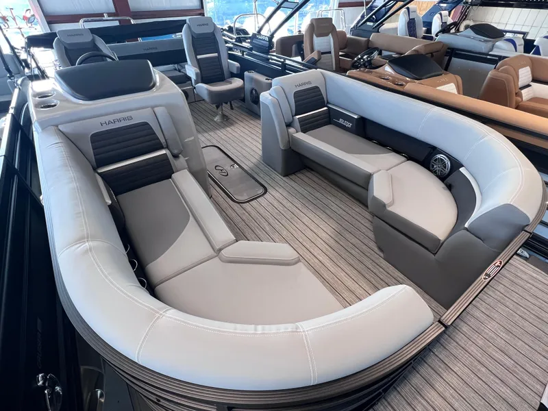 Slide: The Image of 2024 Harris Solstice 230 boat interior with luxurious seating and modern design. - 6