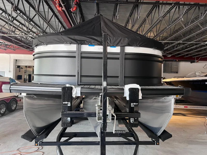 Slide: The Image of 2024 Harris Solstice 230 pontoon boat in storage facility. - 8