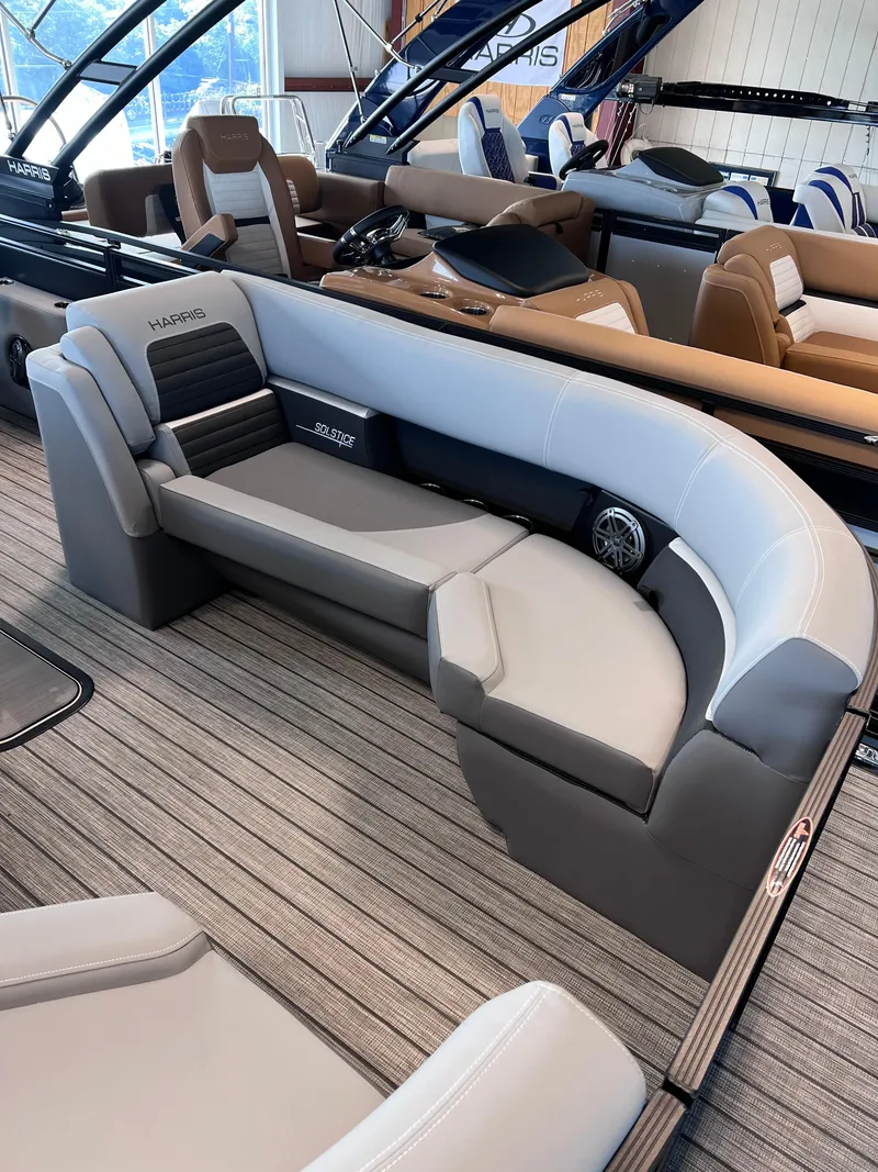 Slide: The Image of 2024 Harris Solstice 230 boat interior with luxurious seating and modern design. - 9