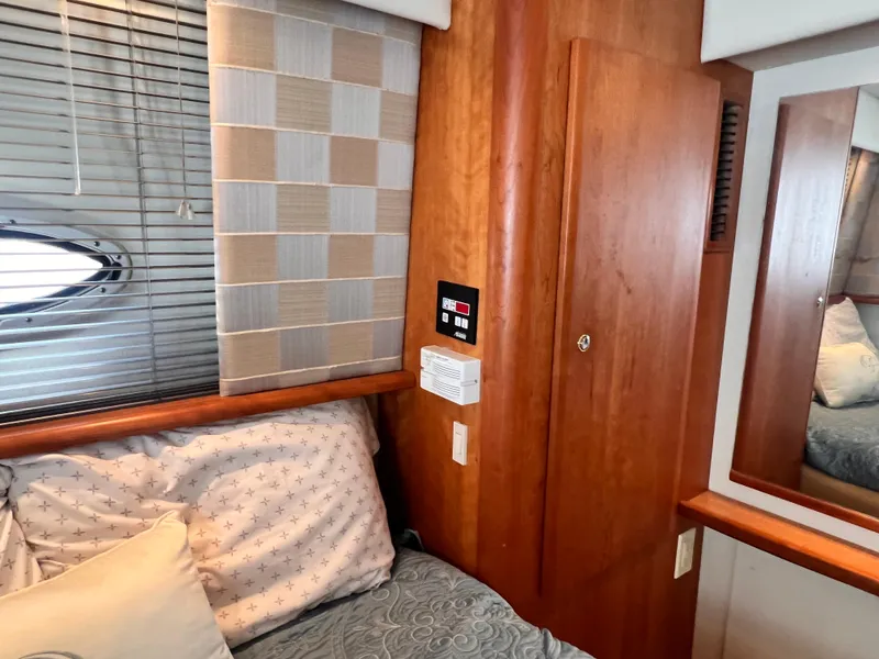 Slide: The Image of Interior cabin of 2001 Silverton 352 Motor Yacht with wooden paneling and bed. - 22