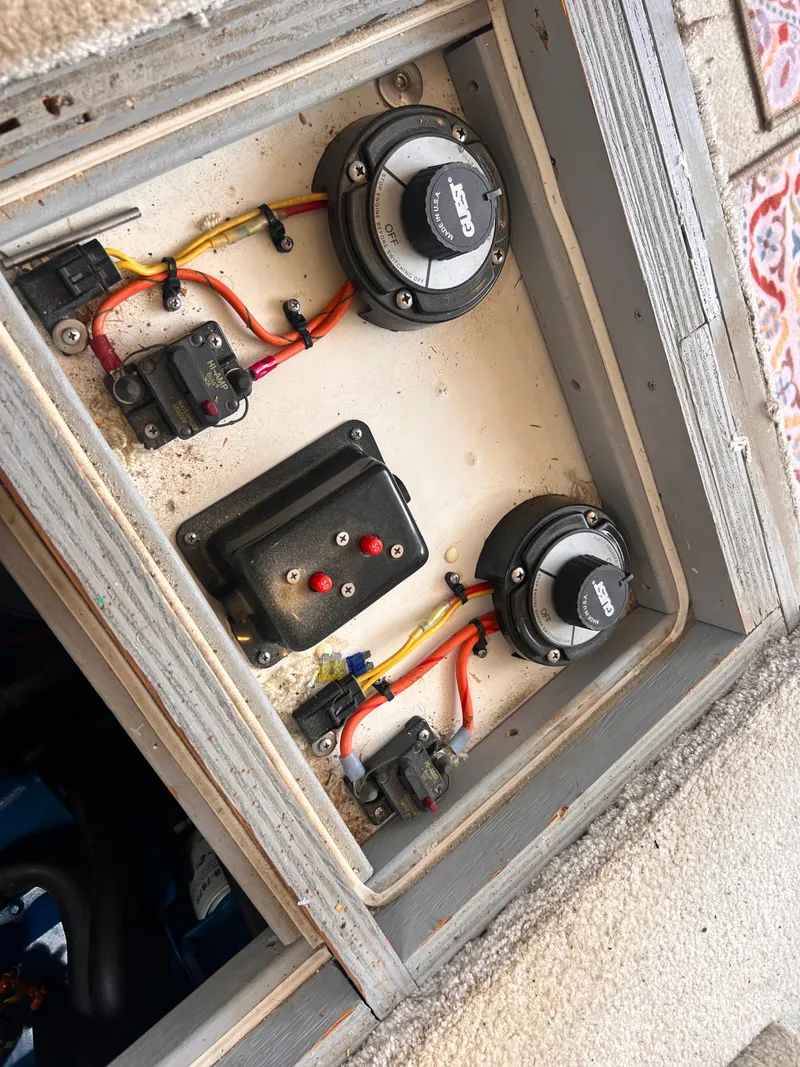 Slide: The Image of Electrical panel of a 2001 Silverton 352 Motor Yacht with wiring and switches. - 25