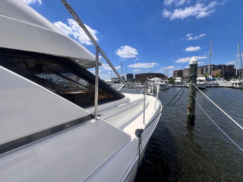 Slide: The Image of 2001 Silverton 352 Motor Yacht docked at a marina on a sunny day. - 3