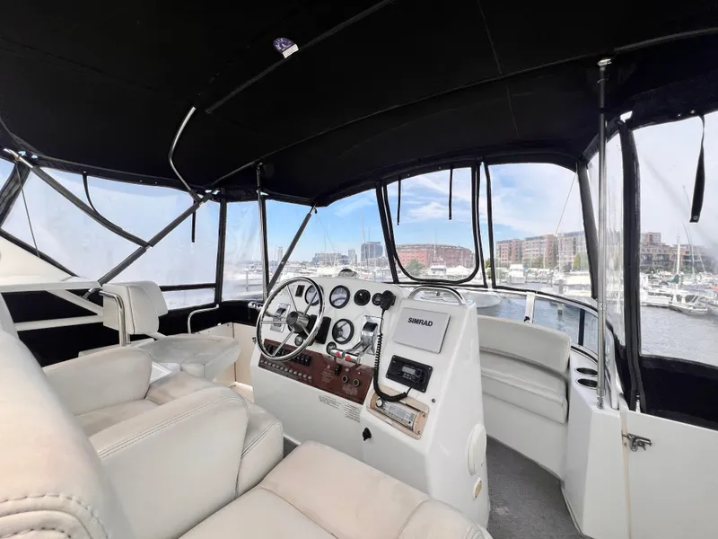 Slide: The Image of 2001 Silverton 352 Motor Yacht helm with marina view. - 36