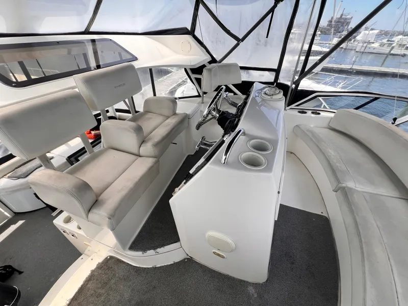 Slide: The Image of Interior helm of 2001 Silverton 352 Motor Yacht with seating and steering controls. - 37