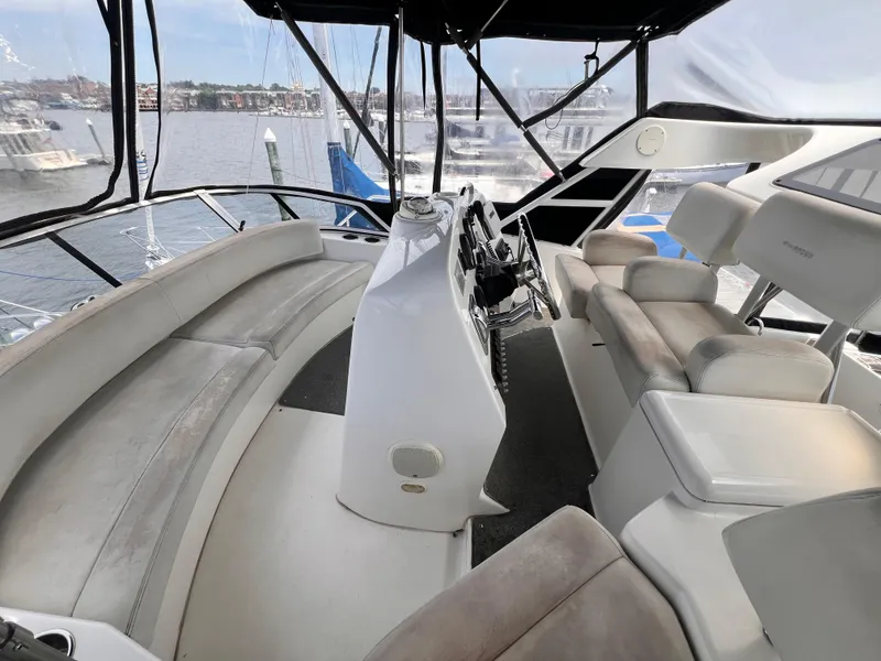Slide: The Image of 2001 Silverton 352 Motor Yacht interior with helm and seating area. - 39