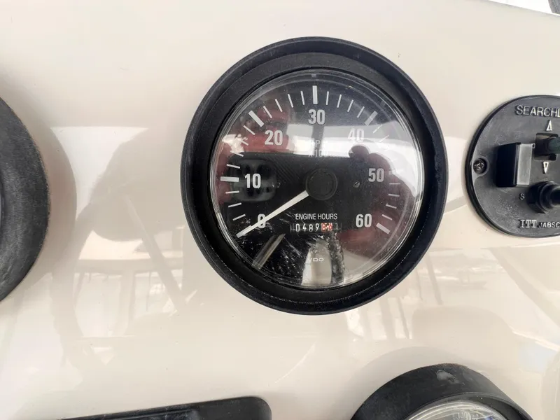 Slide: The Image of Engine hours gauge on a 2001 Silverton 352 Motor Yacht showing 489.4 hours. - 41