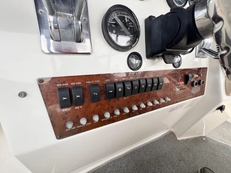 Slide: The Image of Control panel of a 2001 Silverton 352 Motor Yacht with switches and gauges. - 45