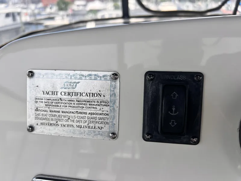 Slide: The Image of Yacht certification plaque and windlass control on a 2001 Silverton 352 Motor Yacht. - 46