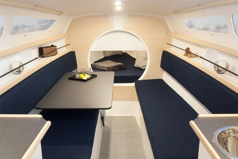 Slide: The Image of Interior of 2026 Dragonfly 25 sailboat with modern seating and table setup. - 3