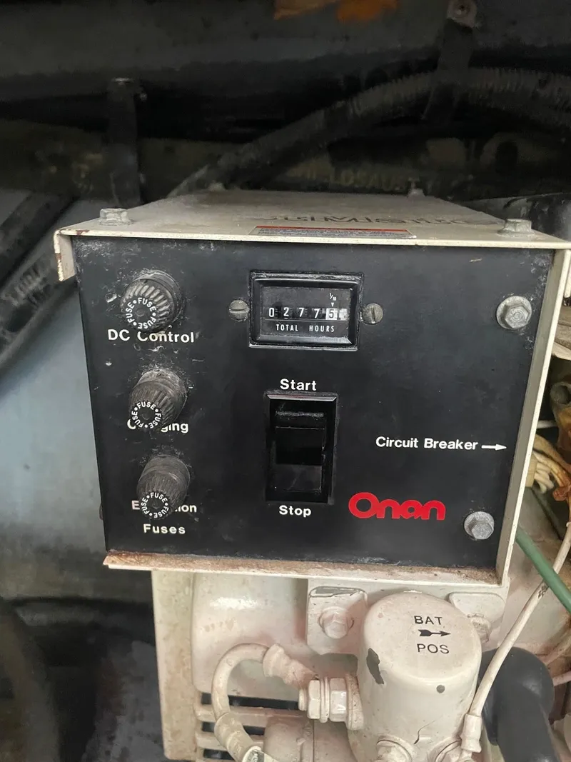 Slide: The Image of 1988 Sea Ray Sundancer 268 Onan generator control panel. - 15