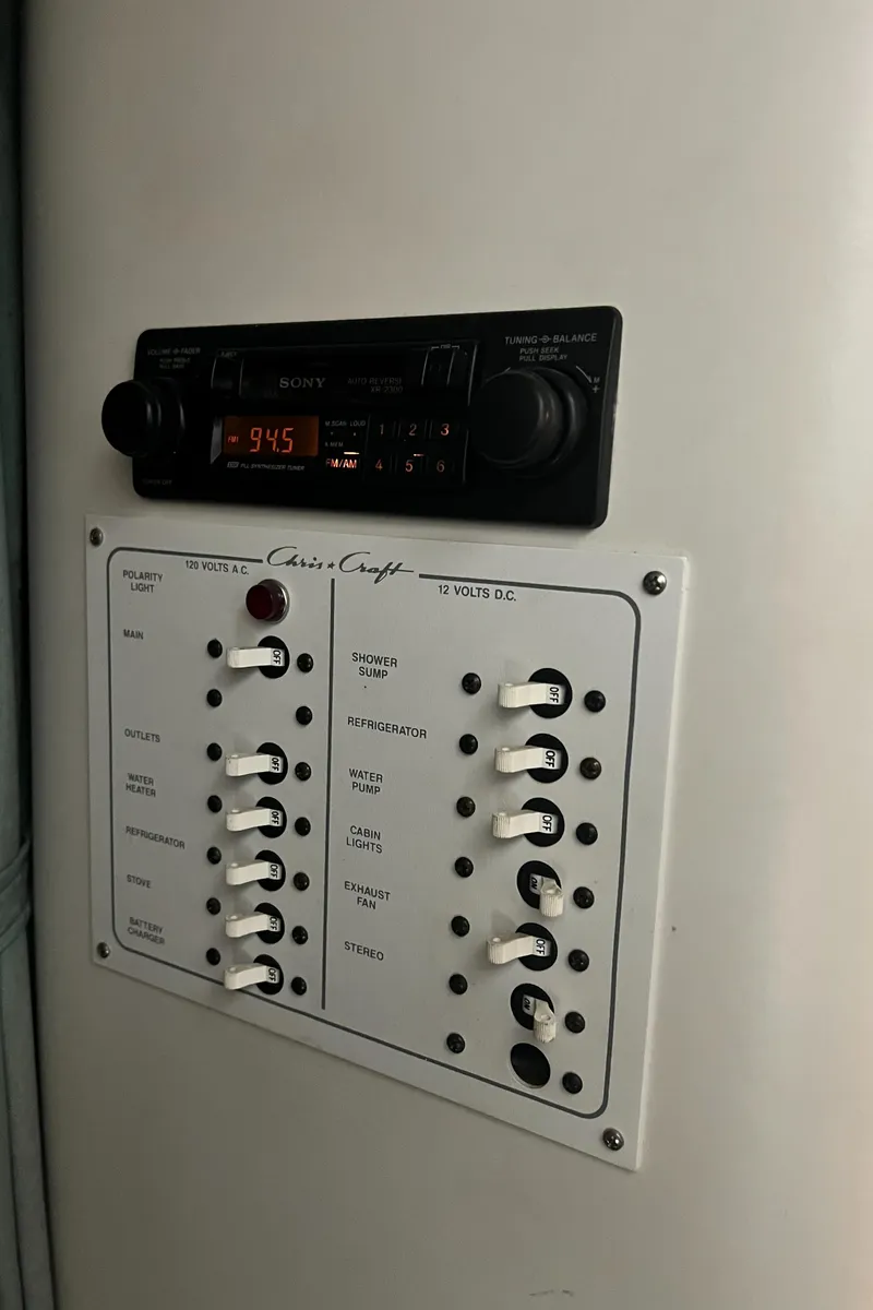 Slide: The Image of 1994 Chris-Craft 262 Crowne control panel and radio system. - 14