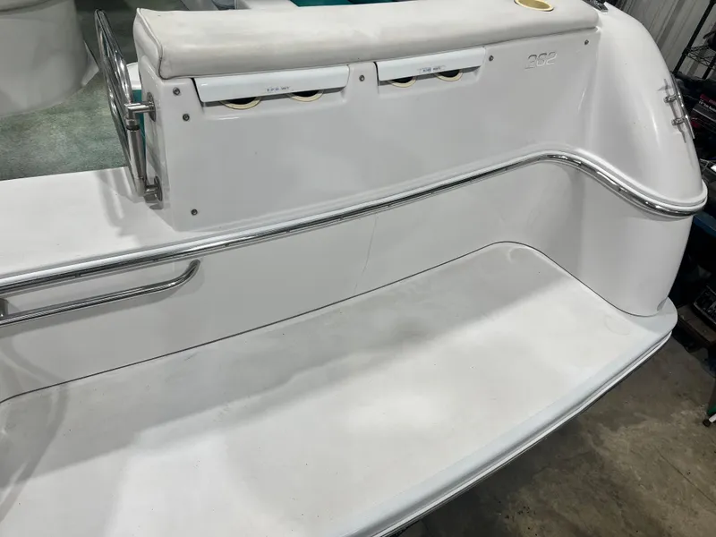 Slide: The Image of 1994 Chris-Craft 262 Crowne boat stern with seating and storage compartments. - 2