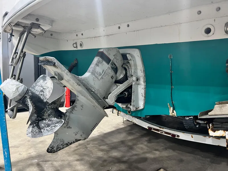 Slide: The Image of Close-up of the propeller and stern drive of a 1994 Chris-Craft 262 Crowne boat. - 3