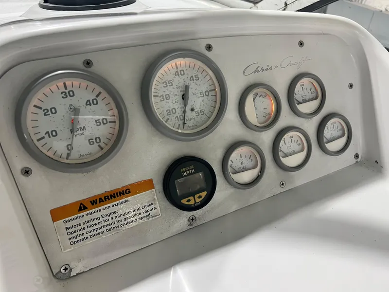 Slide: The Image of 1994 Chris-Craft 262 Crowne dashboard with gauges and warning label. - 5
