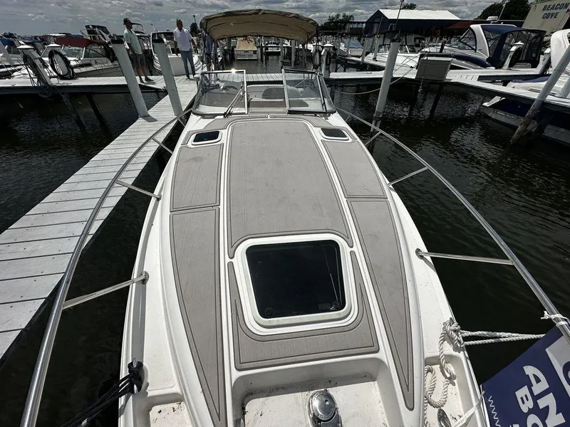 Slide: The Image of 2005 Regal Commodore 27 docked at marina, view of bow and deck. - 3