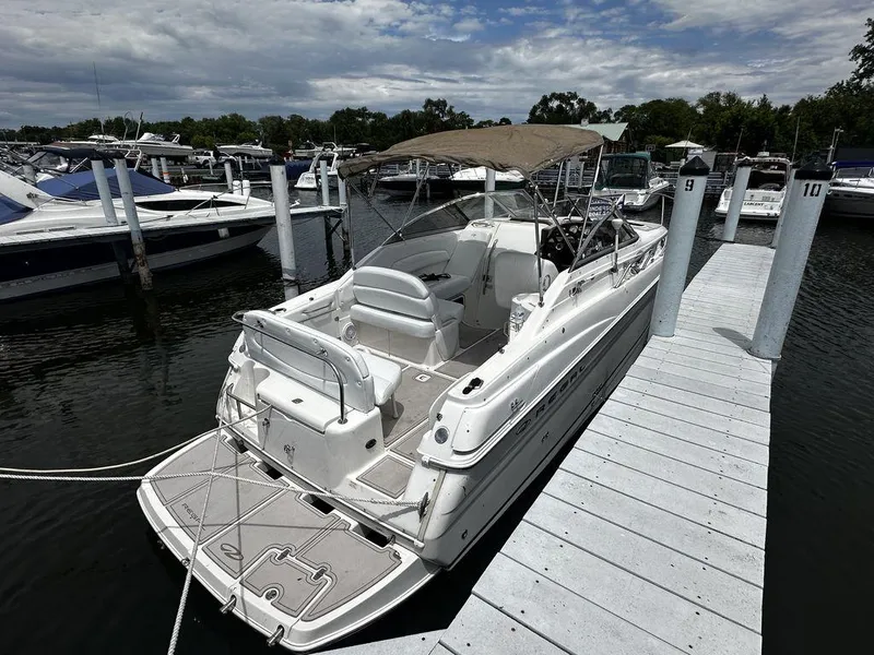Slide: The Image of 2005 Regal Commodore 27 docked at marina with canopy. - 5