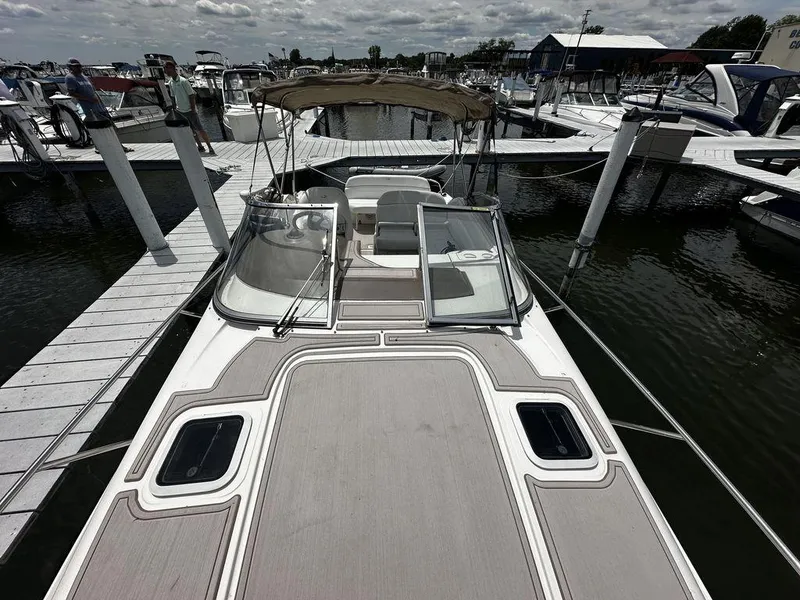 Slide: The Image of 2005 Regal Commodore 27 docked at a marina. - 7