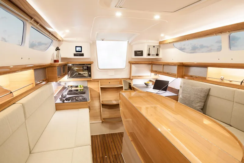 Slide: The Image of Luxurious interior of 2026 Dragonfly 32 sailboat with modern kitchen and seating area. - 7