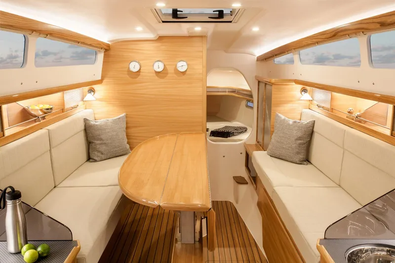 Slide: The Image of Luxurious interior of 2026 Dragonfly 32 sailboat with wooden finishes and cozy seating. - 8